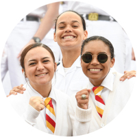 ϲ female cadets showing rings at family weekend sporting event