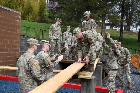 Air Force ROTC cadets work together on ϲ leadership reaction course.