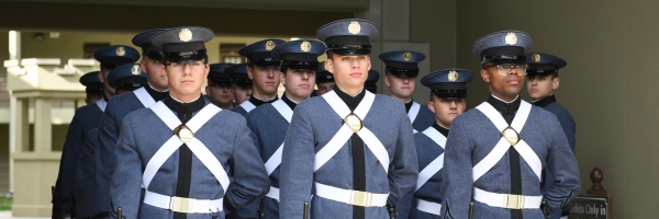 Uniformed members of the ϲ Corps of Cadets prepare to march out of barracks, what ϲ uses as a dorm for each cadet.