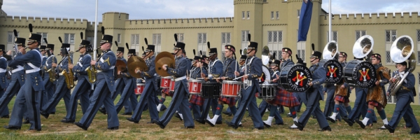 Members of the Corps of Cadets march in a Founders Day parade at ϲ.