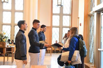 William Wallace ’22, Dane Hamilton ’22, and Kelly Rollison ’22 greet prospective cadets and their families in Lejeune Hall during Open House Oct. 15.—ϲ Photo by Kelly Nye.